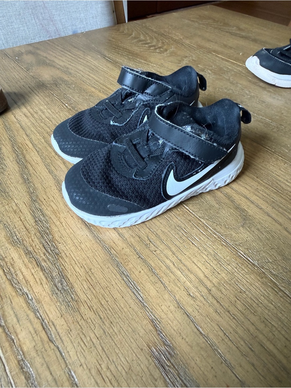 Nike Revolution Kids Black and White Athletic Sneaker